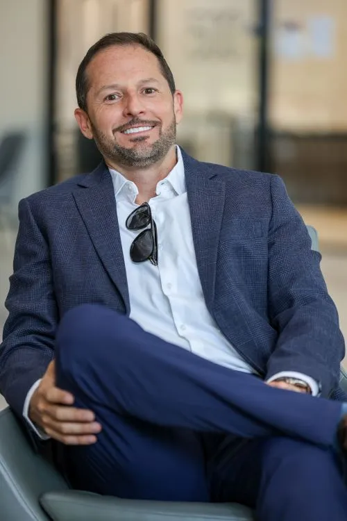 Image of Mike Wallens, ITECS Sales and Marketing Consulting, sitting in a chair